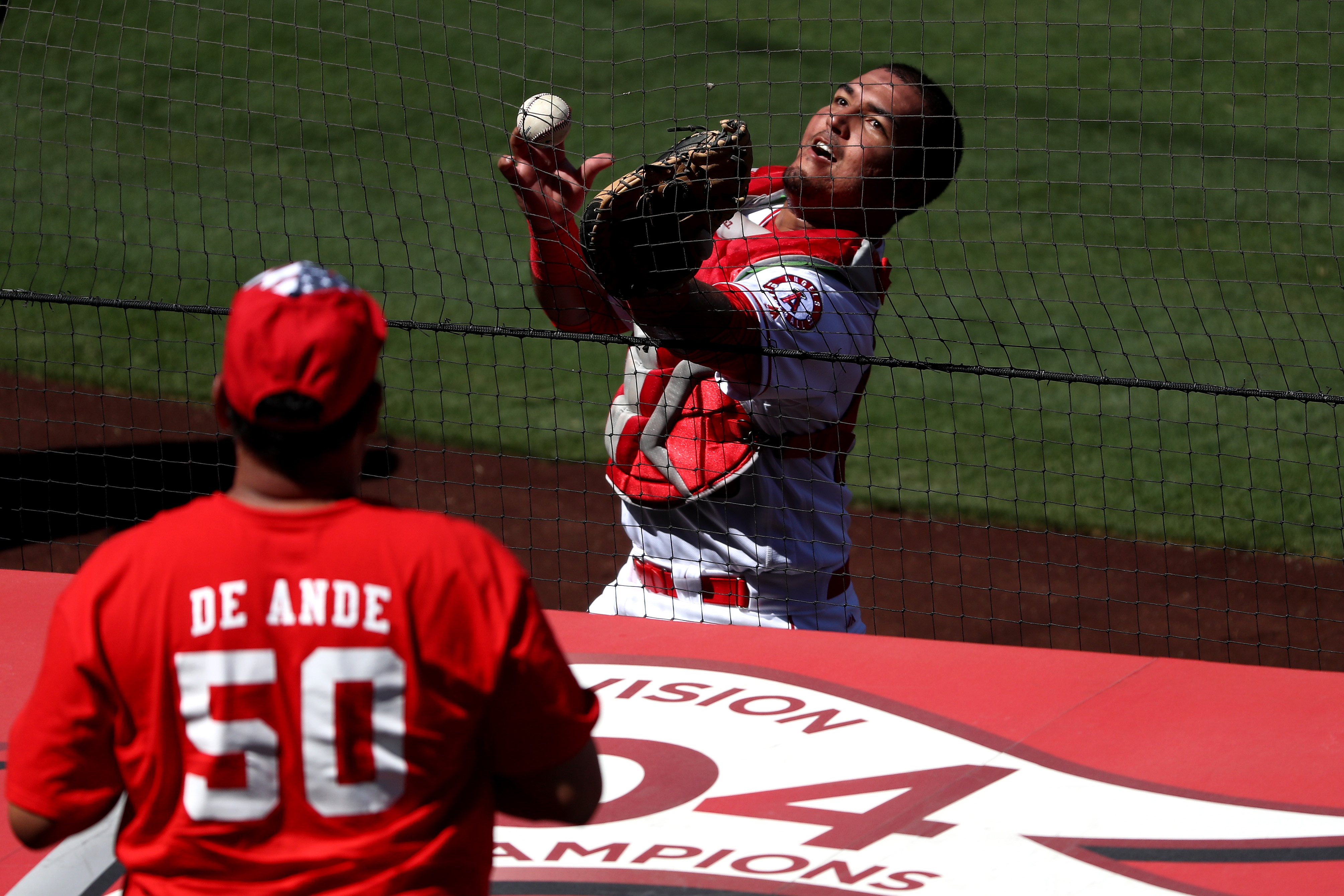 ANAHEIM, CA - SEPTEMBER 11: Carlos Perez #58 of the Los Angeles Angels of Anaheim drops a fould ball hit by Carlos Gomez #14 of the Texas Rangers during the fifth inning of a game at Angel Stadium of Anaheim on September 11, 2016 in Anaheim, California. (Photo by Sean M. Haffey/Getty Images)