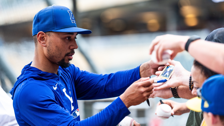 Mookie Betts #50 of the Los Angeles Dodgers signs autographs before the game against the Minnesota Twins at Target Field on June 22, 2026 in Minneapolis, Minnesota. (Photo by Stephen Maturen/Getty Images)