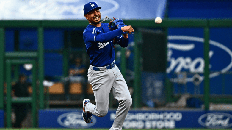 Mookie Betts #50 of the Los Angeles Dodgers throws to first base to force out Jake Mangum #28 of the Pittsburgh Pirates (not pictured) in the fifth inning during the game at PNC Park on June 11, 2026 in Pittsburgh, Pennsylvania. (Photo by Justin Berl/Getty Images)