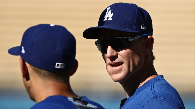 Chase Utley #26 of the Los Angeles Dodgers (R) talks with teammate Austin Barnes #15 during batting practice prior to the MLB game against the Los Angeles Angels of Anaheim at Dodger Stadium on July 13, 2018 in Los Angeles, California. (Photo by Victor Decolongon/Getty Images)