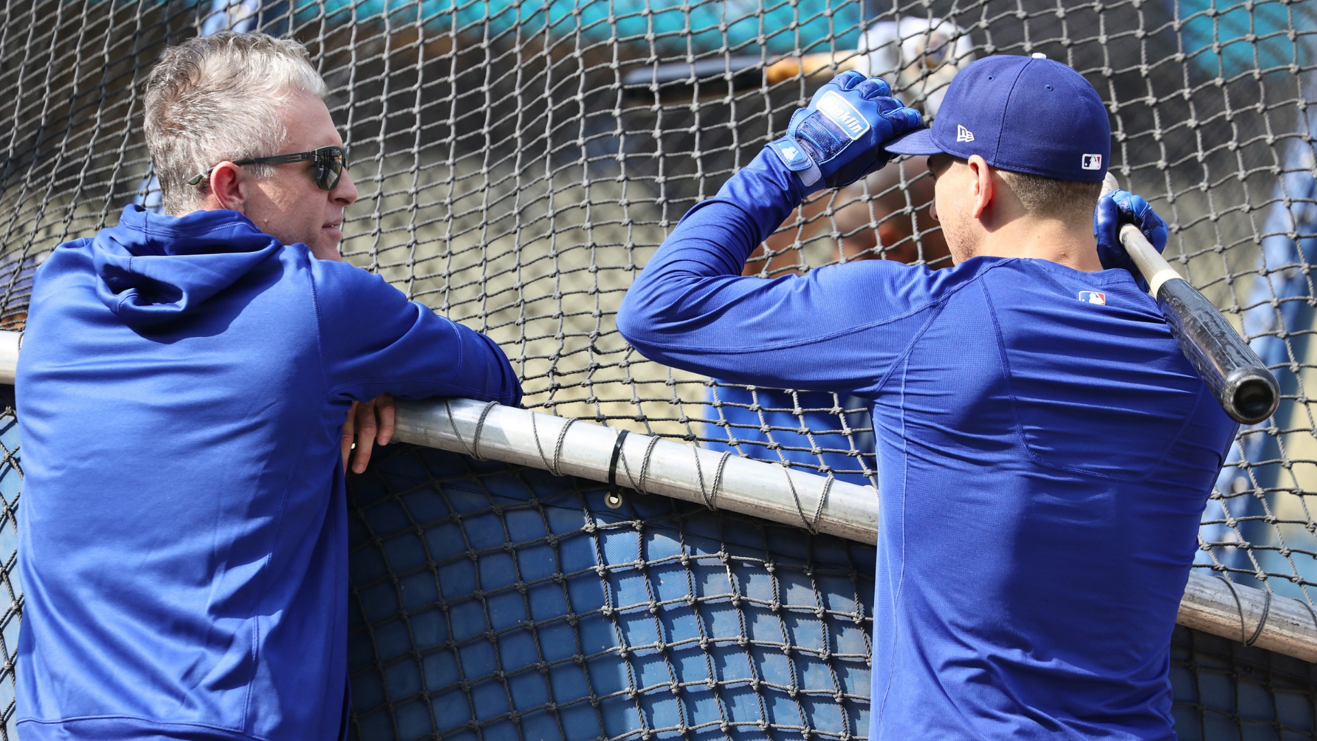 Chase Utley and Austin Barnes #15 of the Los Angeles Dodgers talk during batting practice prior to their National League Wild Card Game against the St. Louis Cardinals at Dodger Stadium on October 06, 2021 in Los Angeles, California. (Photo by Harry How/Getty Images)