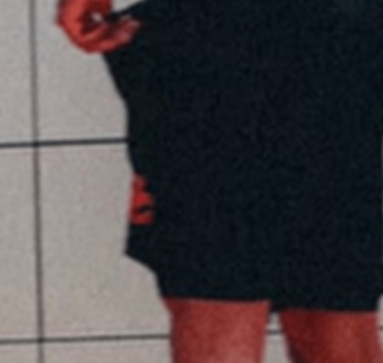 Close-up of the red logo on DeMar DeRozan's black workout shorts that sparked debate among NBA fans during free agency.