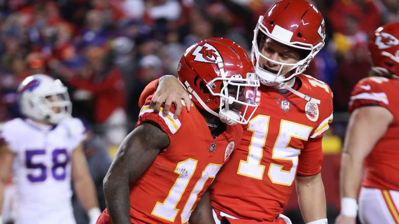 Tyreek Hill #10 of the Kansas City Chiefs celebrates with teammate Patrick Mahomes #15 after scoring a 64 yard touchdown against the Buffalo Bills during the fourth quarter in the AFC Divisional Playoff game at Arrowhead Stadium on January 23, 2022