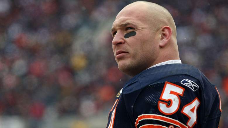 Bears legend Brian Urlacher looks on.