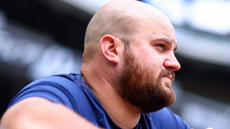 Rowdy Tellez #11 of the Milwaukee Brewers looks on from the dugout before the start of a game against the Atlanta Braves at Truist Park on May 7, 2022 in Atlanta, Georgia.