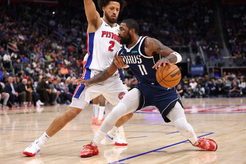 Dallas Mavericks guard Kyrie Irving dribbles during an NBA game amid trade speculation involving the Detroit Pistons.