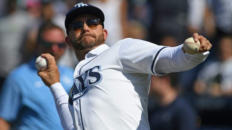 Evan Longoria tosses balls into the crowd