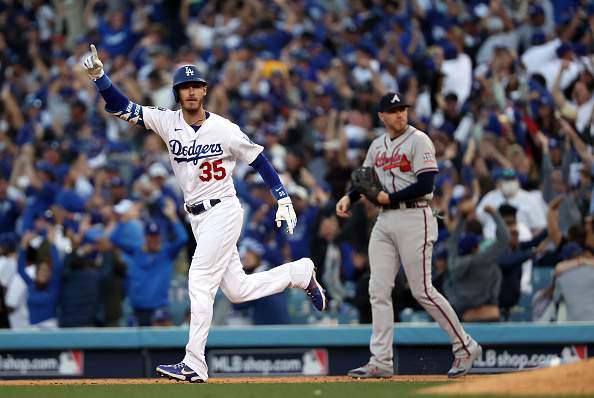 LOS ANGELES, CALIFORNIA - OCTOBER 19:  Cody Bellinger #35 of the Los Angeles Dodgers reacts as he hits a 3-run home run during the 8th inning of Game 3 of the National League Championship Series against the Atlanta Braves at Dodger Stadium on October 19, 2021 in Los Angeles, California. (Photo by Sean M. Haffey/Getty Images)