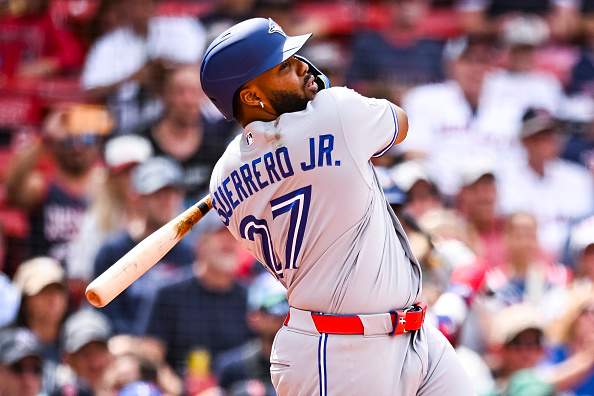 BOSTON, MASSACHUSETTS - JUNE 18: Vladimir Guerrero Jr. #27 of the Toronto Blue Jays hits a fly ball in the eighth inning against the Boston Red Sox at Fenway Park on June 18, 2026 in Boston, Massachusetts. (Photo by Jaiden Tripi/Getty Images)