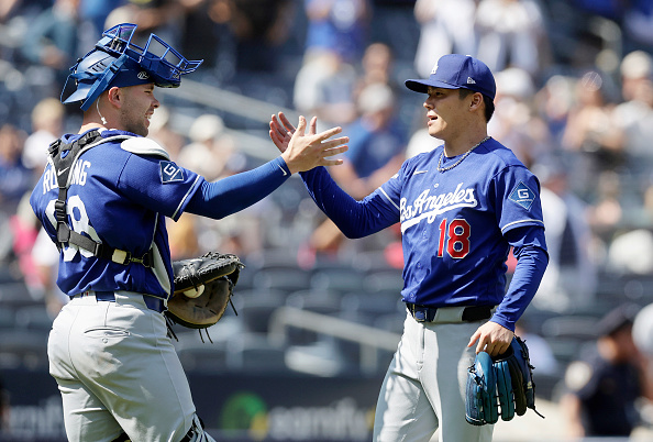 NEW YORK, NEW YORK - JULY 19: Yoshinobu Yamamoto #18 and Dalton Rushing #68 of the Los Angeles Dodgers celebrate after defeating the New York Yankees in game one of a double header at Yankee Stadium on July 19, 2026 in New York City. (Photo by Jim McIsaac/Getty Images)