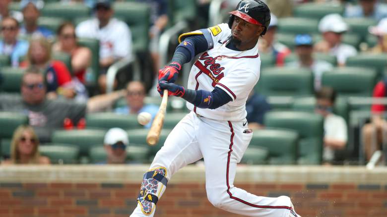 Ozzie Albies #1 of the Atlanta Braves swing a bat.