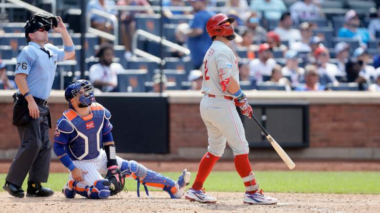 Kyle Schwarber #12 of the Philadelphia Phillies watches the flight of his seventh inning two run home run against the New York Mets.