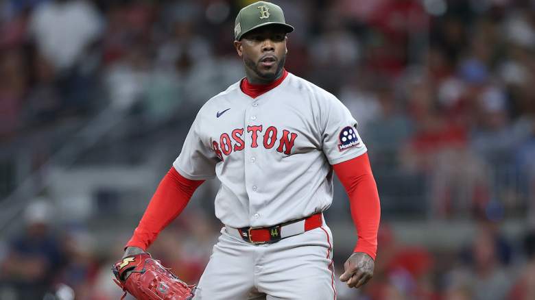 Aroldis Chapman #44 of the Boston Red Sox reacts after striking out Kyle Farmer