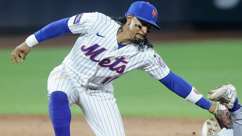 Francisco Lindor #12 of the New York Mets loses the ball at second base