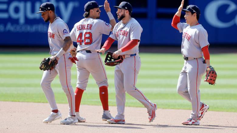 Ceddanne Rafaela #3, Anthony Seigler #48, Wilyer Abreu #52 and Masataka Yoshida #7 of the Boston Red Sox celebrate.