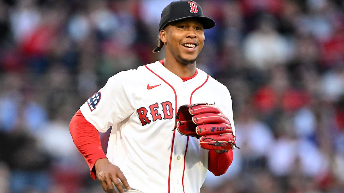 rayan Bello #66 of the Boston Red Sox reacts after throwing to first base for an out.