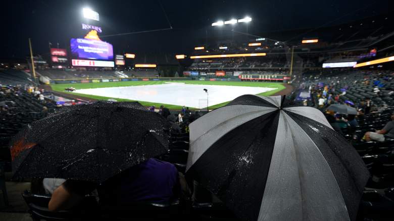 Fans wait out a rain delay before the start of a Colorado Rockies game.