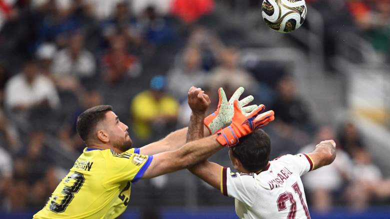 Spain's goalkeeper #23 Unai Simon jumps to make a save