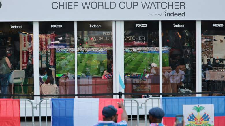 People look on as Austin Franklin and Kevin Akoto, FOX One Chief World Cup Watchers, watch the Senegal versus France World Cup match