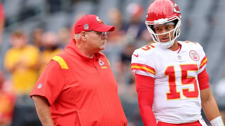 Head coach Andy Reid and Patrick Mahomes #15 of the Kansas City Chiefs talk prior to a preseason game against the Chicago Bears at Soldier Field on August 13, 2022 in Chicago, Illinois