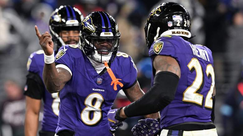 Derrick Henry #22 of the Baltimore Ravens celebrates with Lamar Jackson #8 after scoring touchdown against the Cleveland Browns at M&T Bank Stadium on January 04, 2025 in Baltimore, Maryland