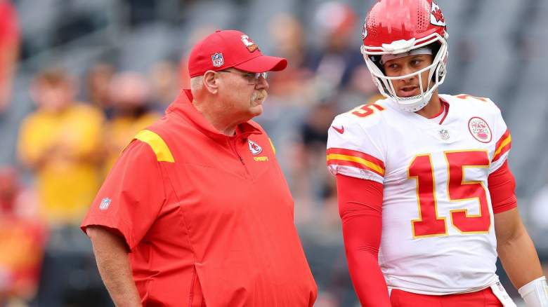 Head coach Andy Reid and Patrick Mahomes #15 of the Kansas City Chiefs talk prior to a preseason game against the Chicago Bears at Soldier Field on August 13, 2022 in Chicago, Illinois