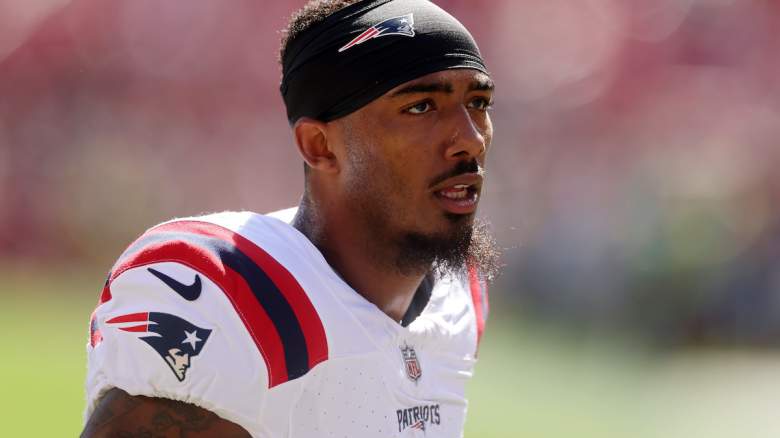 Ja'Lynn Polk #1 of the New England Patriots looks on before the game