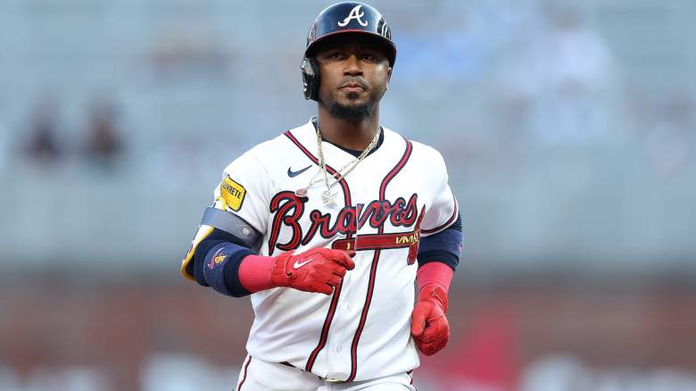 Ozzie Albies #1 of the Atlanta Braves reacts as he rounds third base.