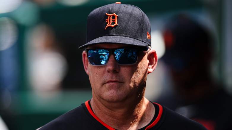 Detroit Tigers' AJ Hinch looking through his sunglasses in the dugout
