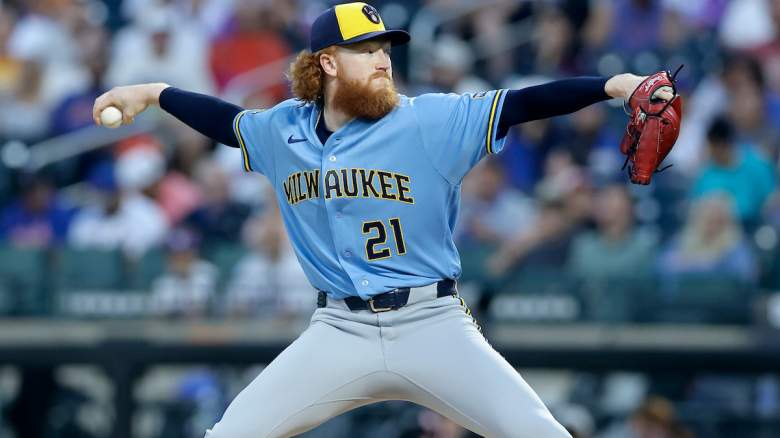 Dustin May #21 of the Milwaukee Brewers throws the first pitch of a game