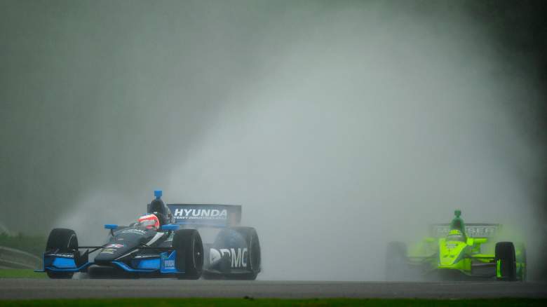 Practice for the IndyCar Series is shown in the rain.