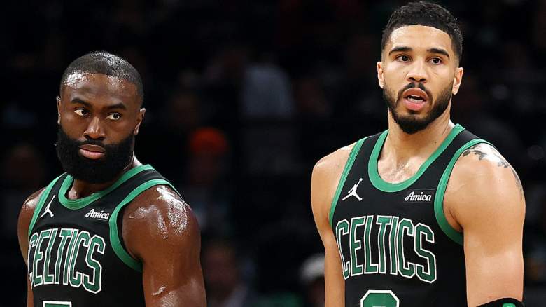 Jayson Tatum #0 of the Boston Celtics and Jaylen Brown #7 look on