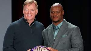 NFL commissioner Roger Goodell presents the Super Bowl LX MVP trophy to Kenneth Walker III #9 of the Seattle Seahawks