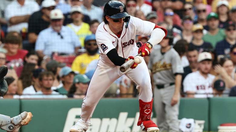 Nick Sogard #20 of the Boston Red Sox lays down a bunt