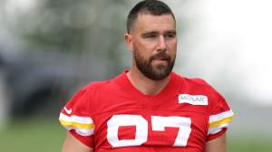 Tight end Travis Kelce #87 walks toward the practice field