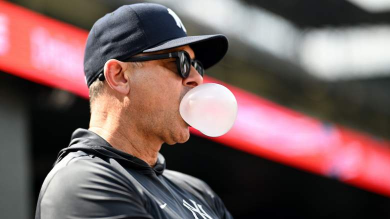 Manager Aaron Boone #17 of the New York Yankees blows a bubble