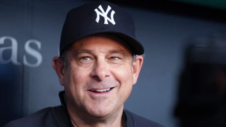 Manager Aaron Boone #17 of the New York Yankees talks with members of the press.