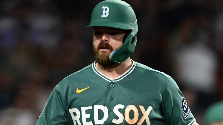 Jake Rogers #46 of the Boston Red Sox high-fives Caleb Durbin