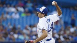 Derek Law #64 of the Toronto Blue Jays pitches to close out a 5-4 win over the New York Yankees during MLB action at Rogers Centre on August 10, 2019 in Toronto, Canada.