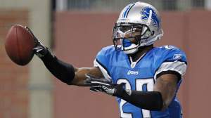 Alphonso Smith #27 of the Detroit Lions celebrates a touchdown after a second quarter interception while playing the the Minnesota Vikings at Ford Field on December 11, 2011 in Detroit, Michigan.