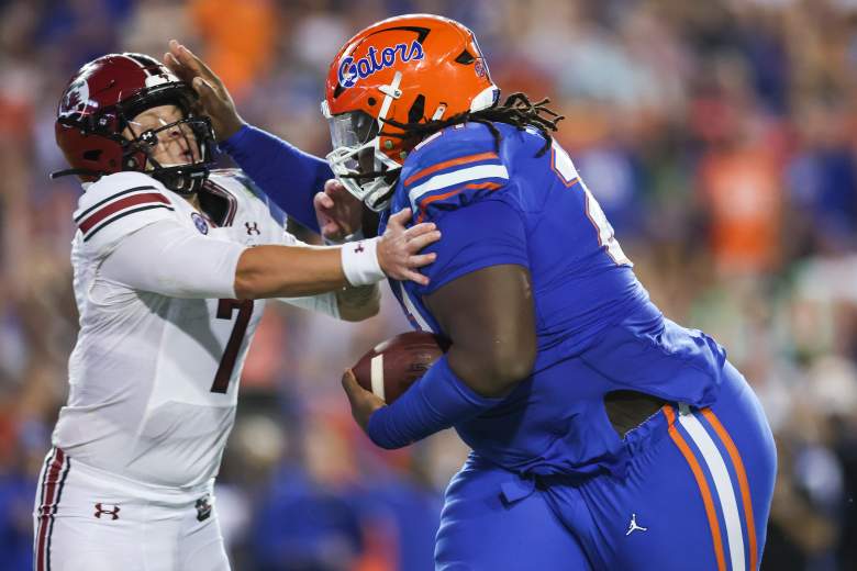 Desmond Watson stiff arms Spencer Rattler while playing for Florida against South Carolina.