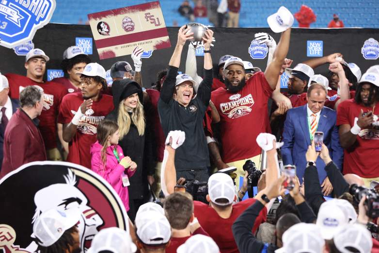 Mike Norvell hoists ACC Championship Trophy