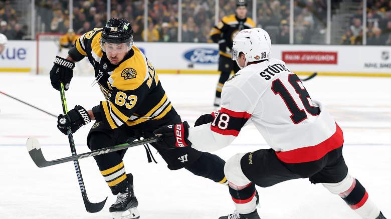 Brad Marchand #63 of the Boston Bruins skates against Tim Stützle #18 of the Ottawa Senators during the third period at TD Garden on January 23, 2025 in Boston, Massachusetts. The Bruins defeat the Senators 2-0.