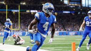 DJ. Reed #4 of the Detroit Lions celebrates an interception with teammates during the second quarter against the Cleveland Browns at Ford Field on September 28, 2025 in Detroit, Michigan