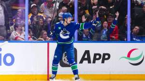 Zeev Buium #24 of the Vancouver Canucks celebrates after scoring a goal against the Los Angeles Kings during the second period of their NHL game at Rogers Arena on April 14, 2026 in Vancouver, British Columbia, Canada.