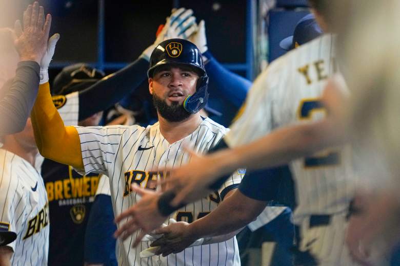 Gary Sanchez gets congratulated in the Brewers dugout.