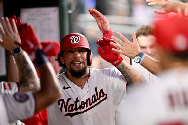 Yohandy Morales is congratulated in the Washington Nationals dugout.