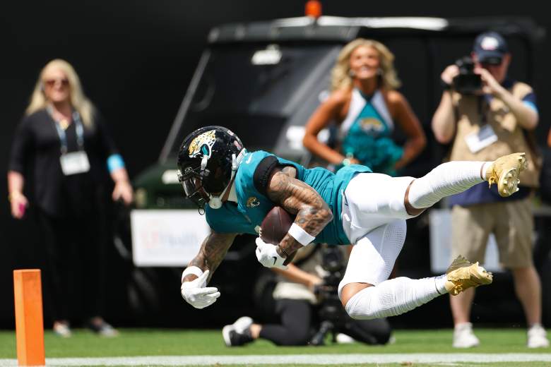 Parker Washington makes an effort to reach the end zone for the Jaguars.