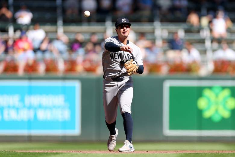 Anthony Volpe throws the ball across the field for the Yankees.