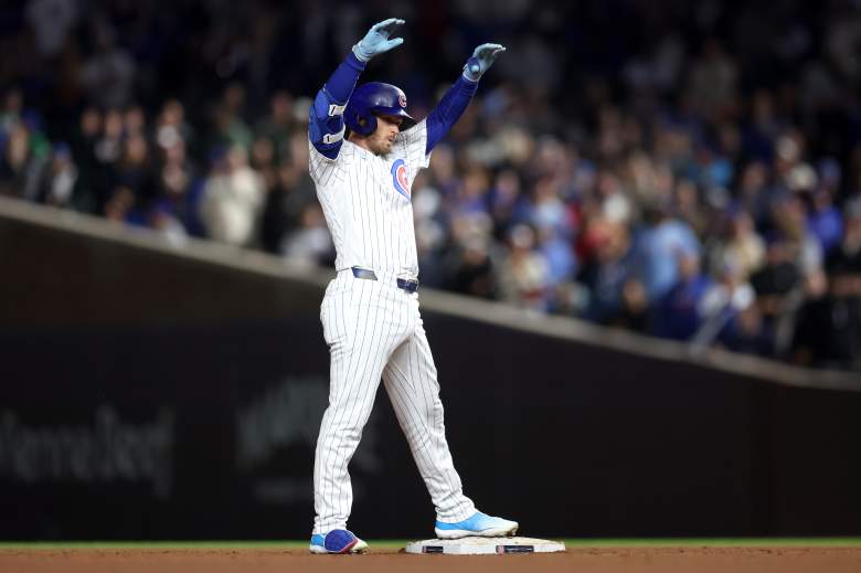 Ian Happ celebrates on second base for the Cubs.